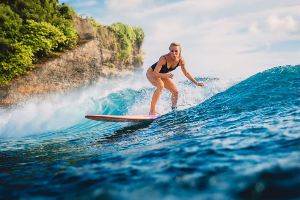 A woman surfing in Costa Rica